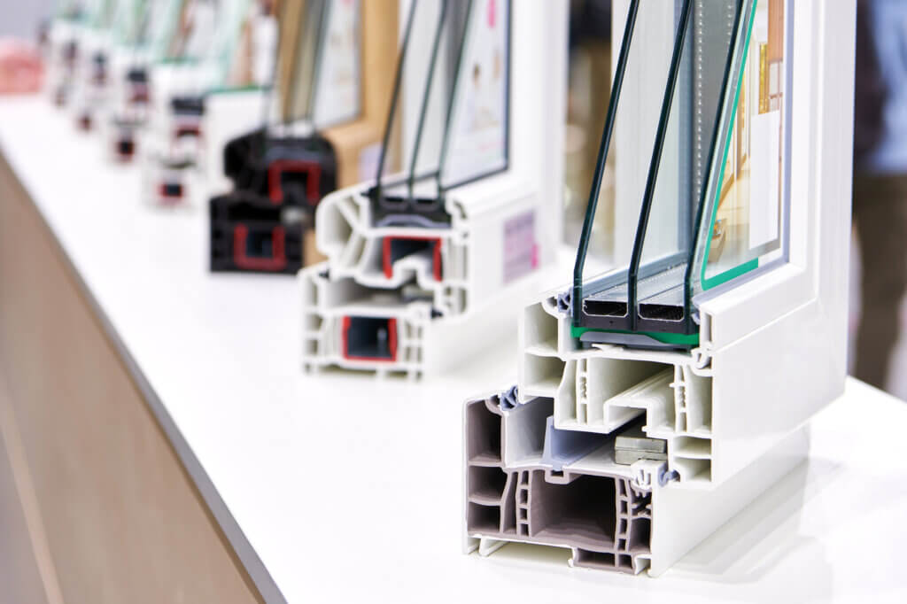 Display of triple-pane window cross-sections showing frame and glass construction.